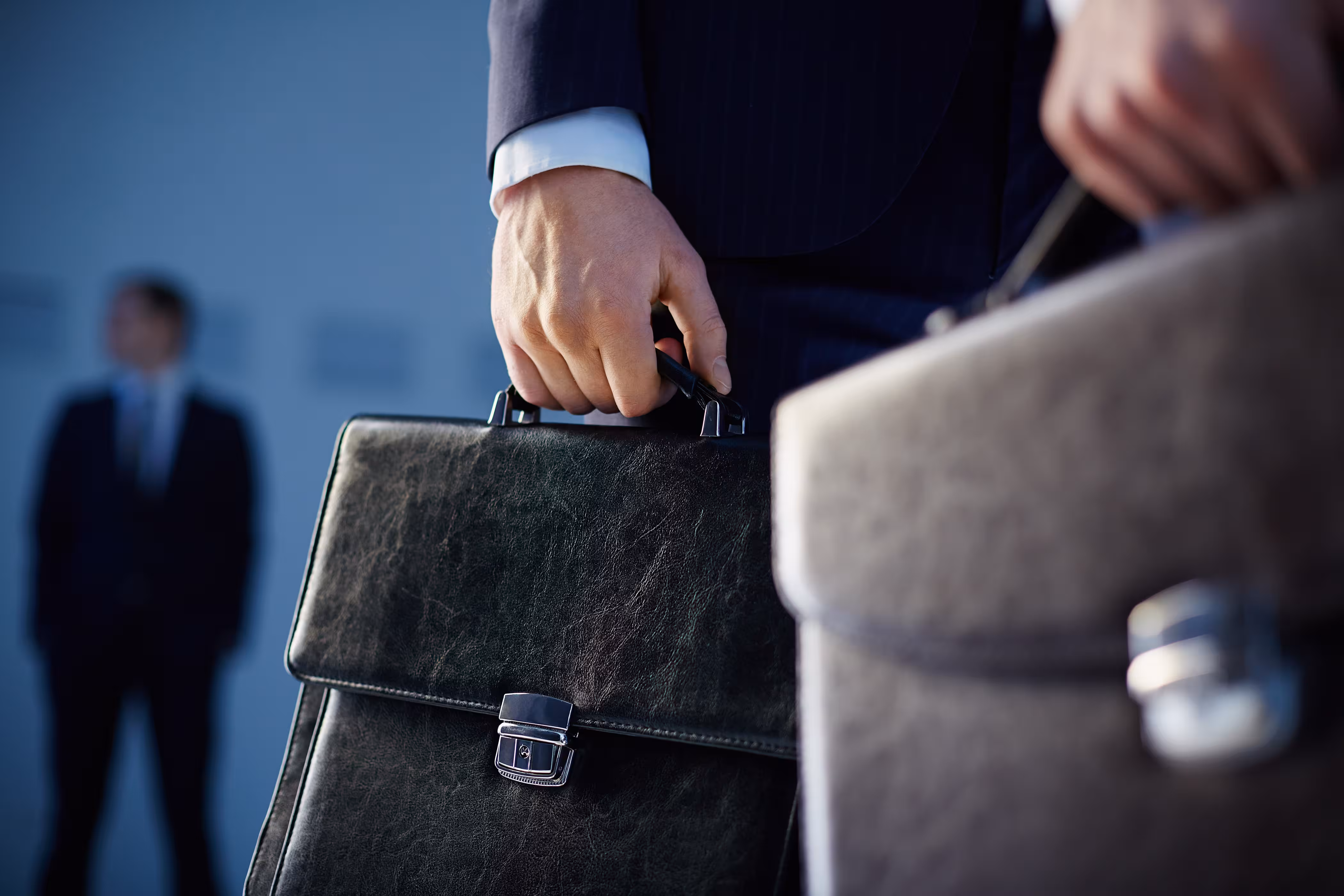 close up workers with briefcases