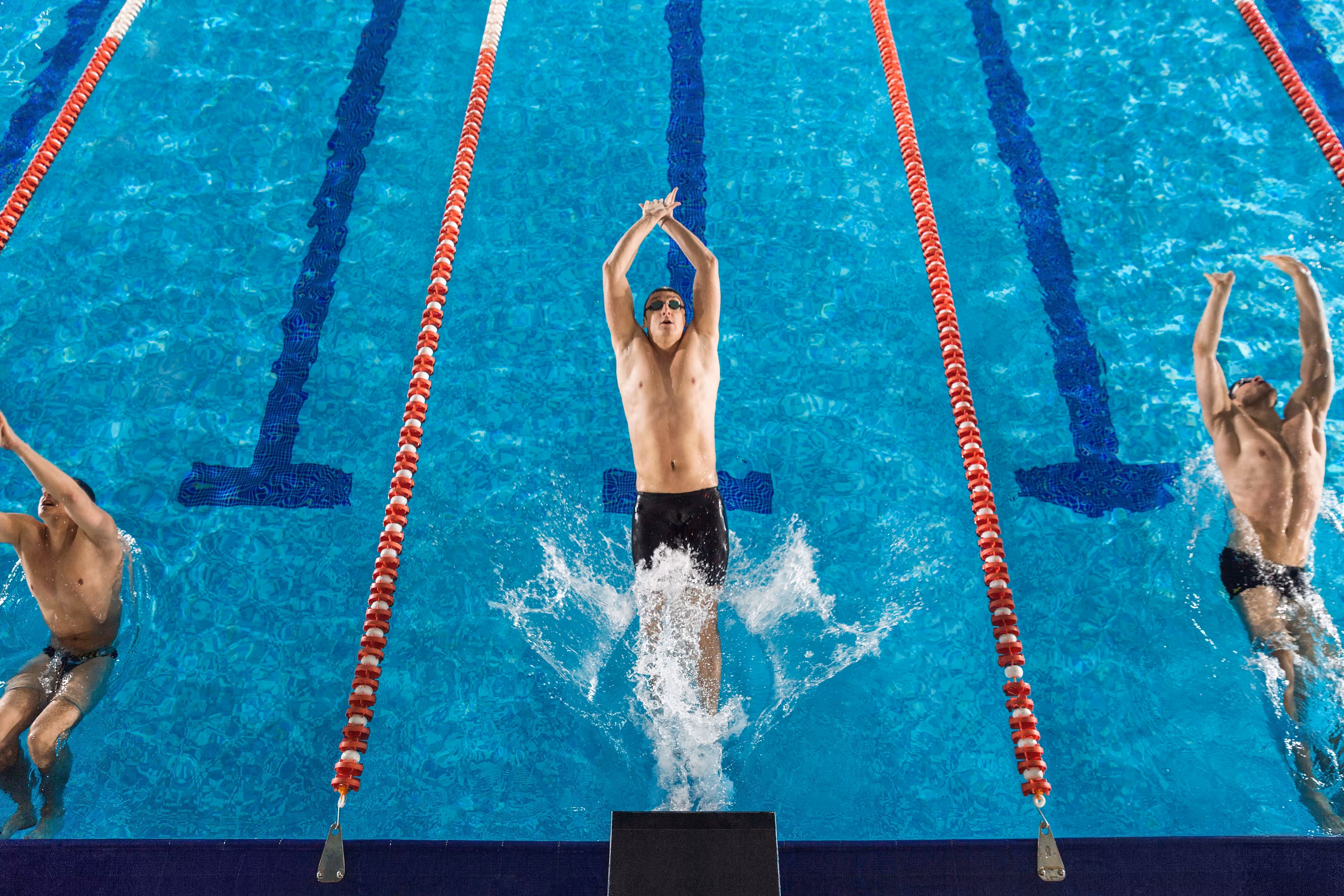 top view three male swimmers